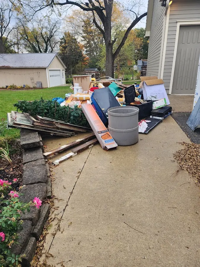 Dumpster being loaded with debris for Roofing Dumpster Rental in Sherwood
